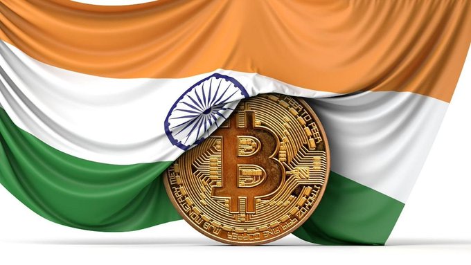 A golden Bitcoin coin rests against a draped Indian flag, symbolizing the nation's growing crypto landscape as India's crypto report heads to Parliament with key recommendations from the Finance Panel.

Key visual elements: Indian tricolor flag (saffron, white, green) with the Ashoka Chakra, and a Bitcoin coin featuring the "B" symbol and "BITCOIN" text along with digital circuit patterns.