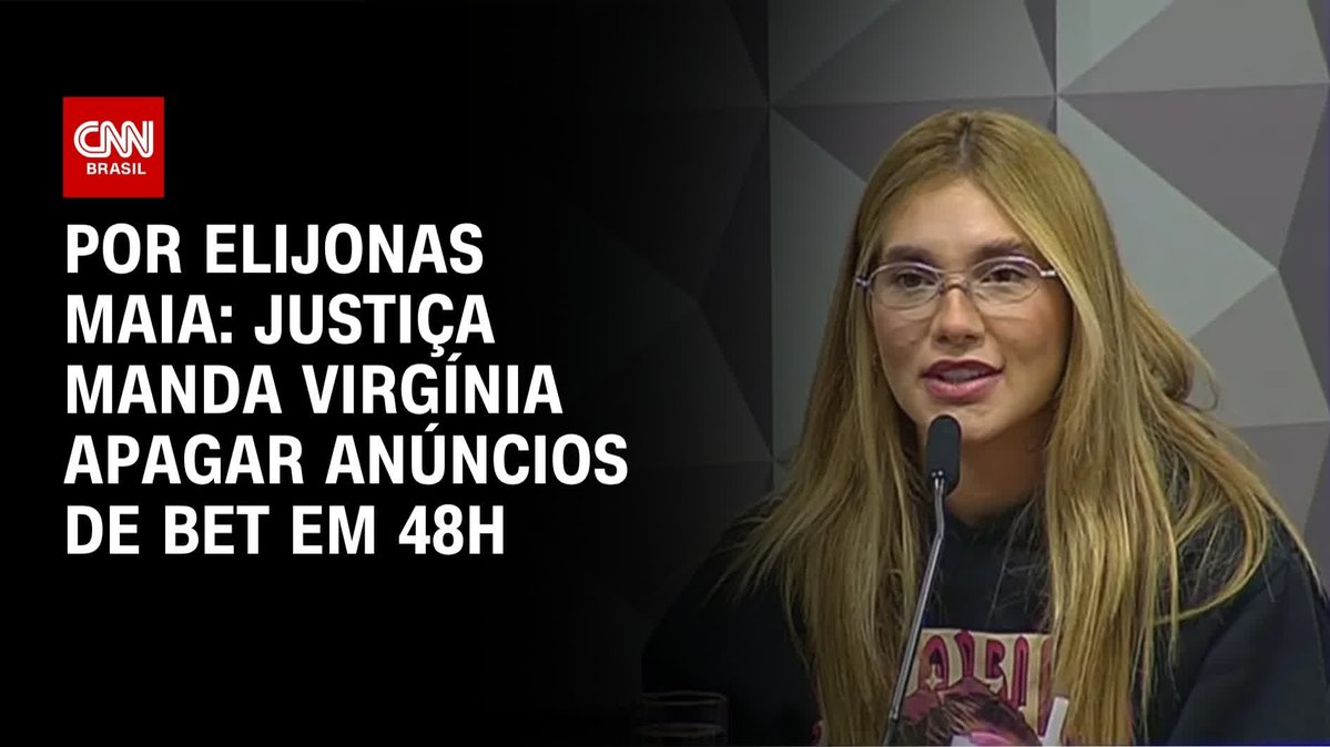 A woman with blonde hair and glasses speaks into a microphone beside a CNN Brasil headline reading "POR ELIJONAS MAIA: JUSTIÇA MANDA VIRGÍNIA APAGAR ANÚNCIOS DE BET EM 48H." The image illustrates the accompanying post about a court ordering Virginia to remove betting advertisements within 48 hours.