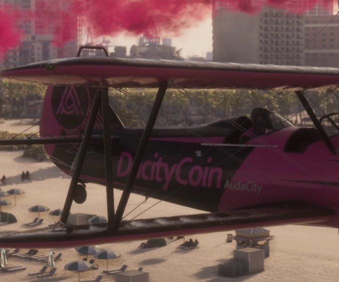 A pink-and-black stunt plane marked “D’acityCoin” and “AudaCity” flies over a beach with red smoke in the background. The image humorously pairs DacityCoin’s flashy marketing with the post’s bearish question about why the token might not run.
