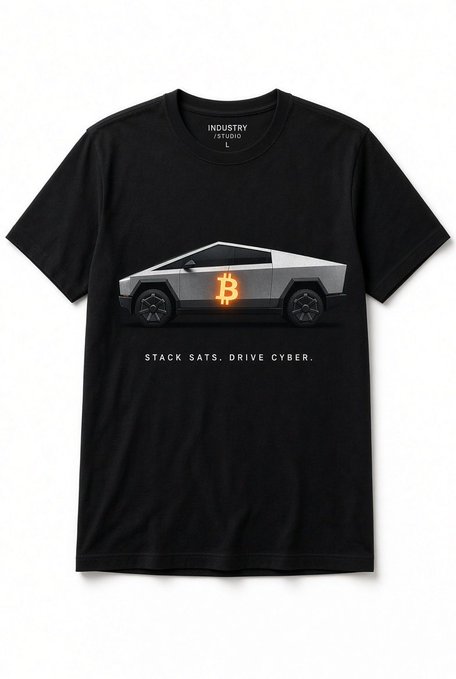 Black t-shirt design featuring a silver Cybertruck with a glowing Bitcoin symbol on the door and the slogan 'STACK SATS. DRIVE CYBER.' below it, by 'INDUSTRY STUDIO'.