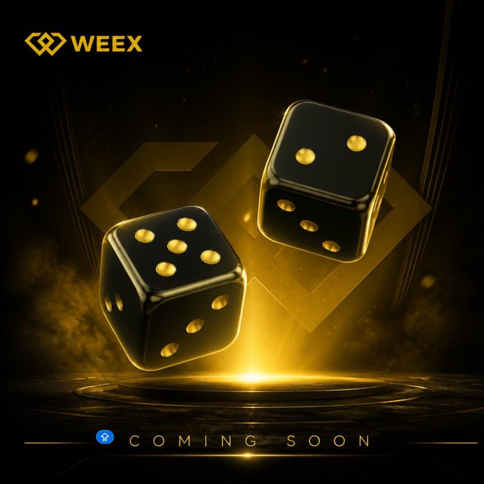The image features two black dice with gold dots, floating in a golden light against a dark background. The text "coming soon" is displayed below them, indicating that the dice are about to be released or will be available shortly.