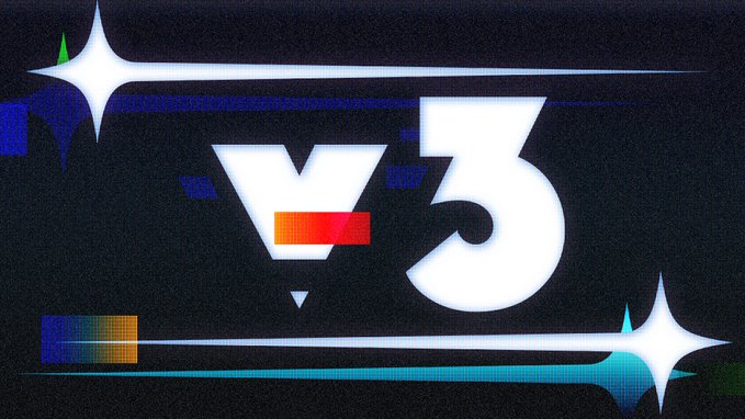 A stylized digital graphic displaying "V3" in large white text against a dark background, accented with bright white starbursts, blue lines, and a small multicolored pixel block.