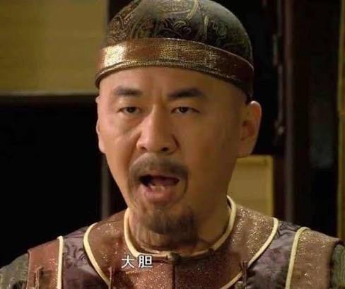 A man in traditional Chinese imperial attire and a dark cap appears to be speaking angrily, with Chinese subtitles '大胆' (audacious) displayed.