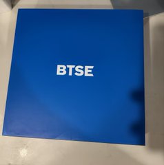 A blue folder or document cover displays the white 'BTSE' logo on a light-colored surface.
