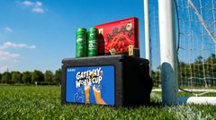 An outdoor soccer-themed display featuring a Galaxy S25+ billboard next to a goal net on a grass field under a blue sky.