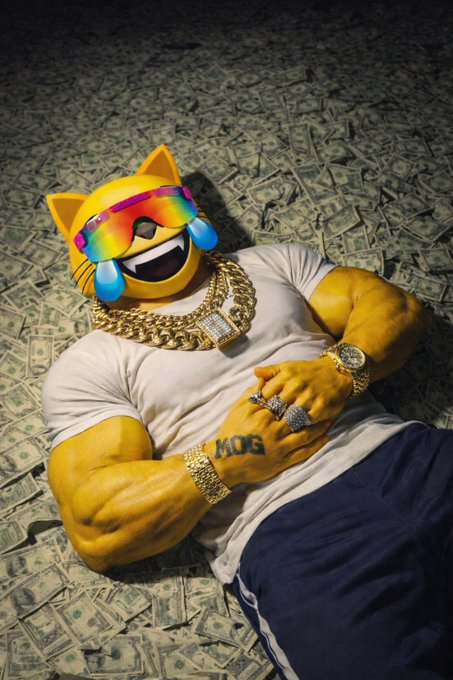 An illustrated muscular yellow cat emoji character wearing rainbow sunglasses, a white shirt, and gold chains, lying on a pile of money with 'MOG' tattooed on its arm.