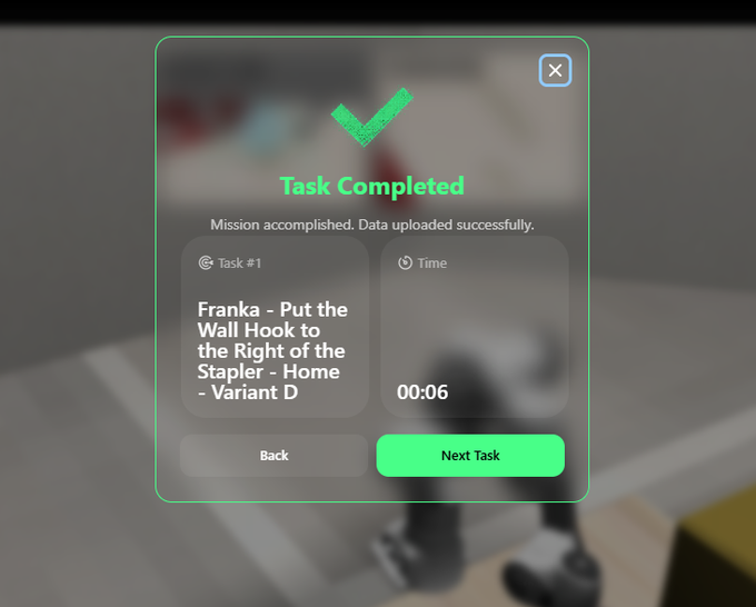 A digital pop-up window with a green checkmark displays 'Task Completed' for 'Franka - Put the Wall Hook to the Right of the Stapler - Home - Variant D' with a completion time of 00:06.