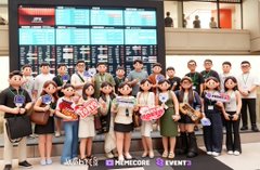 A group of interns poses at the Tokyo Stock Exchange during a tour arranged by WebX_Asia, standing in front of the iconic trading floor displays. The setting ties to the post's highlight of visiting the exchange on the final day of the Japan event, referencing CZ's early career in building trading systems there.