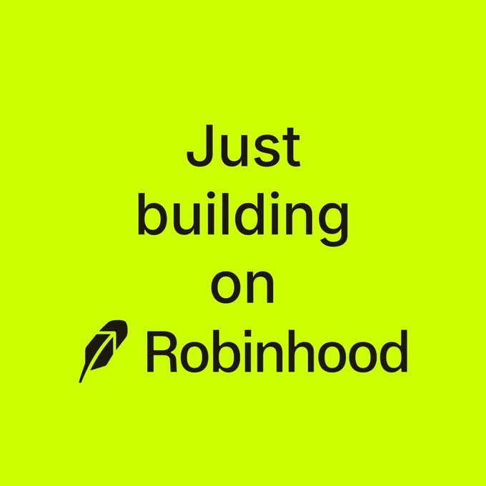 A bright green graphic displays the text "Just building on Robinhood" in black lettering, with the feather icon of the Robinhood logo positioned to the left of the brand name. The image reinforces the accompanying post by promoting engagement with Robinhood's crypto platform.