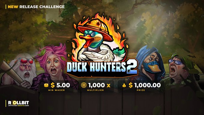A promotional banner for 'DUCK HUNTERS 2' slot game by ROLLBIT, featuring a cartoon duck wearing a firefighter helmet with flames around it. The banner shows a min wager of $5.00, 1,000x multiplier, and $1,000.00 prize, with cartoon characters on either side.