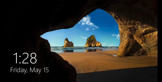 The lock screen displays a serene ocean view through a coastal cave, featuring the time "1:28" and date "Friday, May 15," suggesting that without the right cryptocurrency, one's travel plans are as limited as this secluded, hard-to-reach beach.