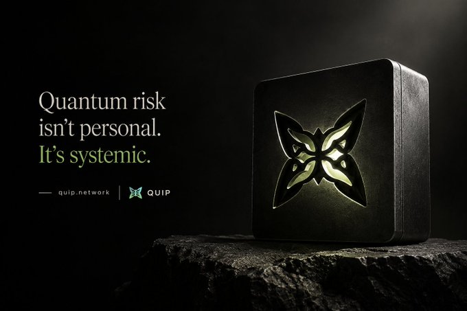 An advertisement for QUIP network with the text 'Quantum risk isn't personal. It's systemic.' next to a black device featuring a glowing geometric logo on a stone surface.