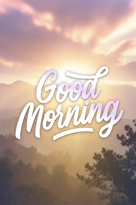 A 'Good Morning' greeting card with elegant cursive text against a backdrop of misty mountains bathed in warm sunrise light.