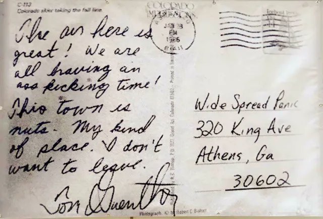 Handwritten postcard postmarked January 1965 from Colorado addressed to W. de Spread Panic at 320 King Ave, Athens, Ga 30602, describing a positive experience in 'hip town' and not wanting to leave.