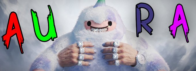 A furry white yeti-like character with a rainbow horn wears large diamond rings and a watch, flanked by colorful graffiti-style letters spelling 'AURA'.