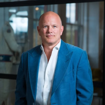 A portrait of Galaxy Digital CEO Mike Novogratz, shown in a blue blazer and white shirt, accompanies his prediction that Bitcoin will trade in the $60K–$80K range for the remainder of 2026 unless favorable conditions push it to $100K.