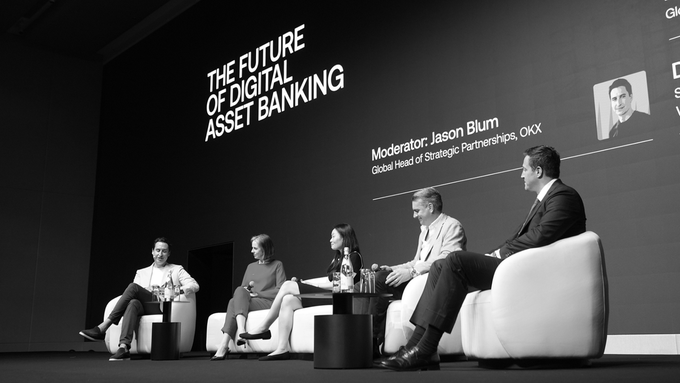 A black and white photo of five people seated on a panel for 'THE FUTURE OF DIGITAL ASSET BANKING', moderated by Jason Blum of OKX.