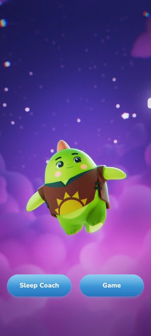 The image shows the sleepagotchi app's home screen featuring a cute green creature with a sun emblem on its chest, floating against a starry purple background, with "Sleep Coach" and "Game" buttons at the bottom—reflecting the smooth, user-friendly experience highlighted in the post about the app's interface.