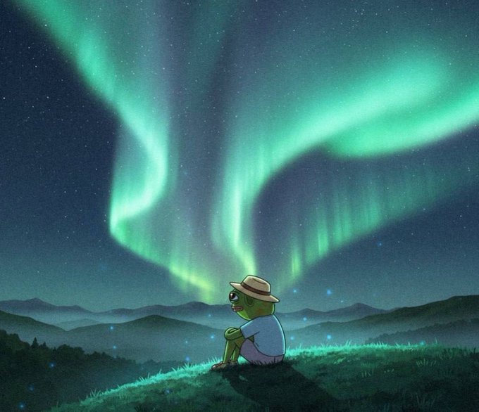 A small green frog character wearing a straw hat and blue shirt sits on a grassy hill, gazing up at a breathtaking display of green auroras swirling across the starry night sky above rolling mountains. The image evokes the whimsical, otherworldly aesthetic of Matt Furie's "Night Riders" series, aligning with the post's mention of the Hoppy character's potential rise and the mystical, early-mover excitement suggested by the aurora-filled sky.