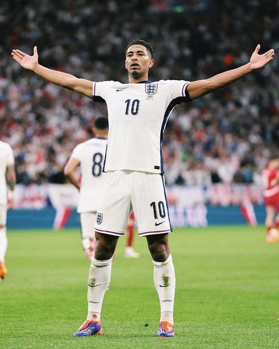 A soccer player wearing the England national team's number 10 jersey celebrates with arms outstretched on the pitch, embodying the "winners finish what they start" message through his triumphant finish to a successful play.