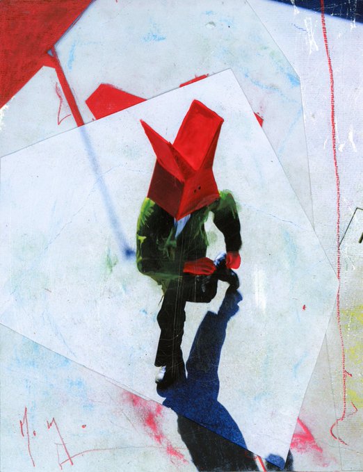 A surreal mixed-media composition shows a figure wearing a red paper boat or geometric origami mask over their head, painted in green tones, standing on a tilted white rectangular plane against a textured background with red and blue paint splatters and scribbled markings.