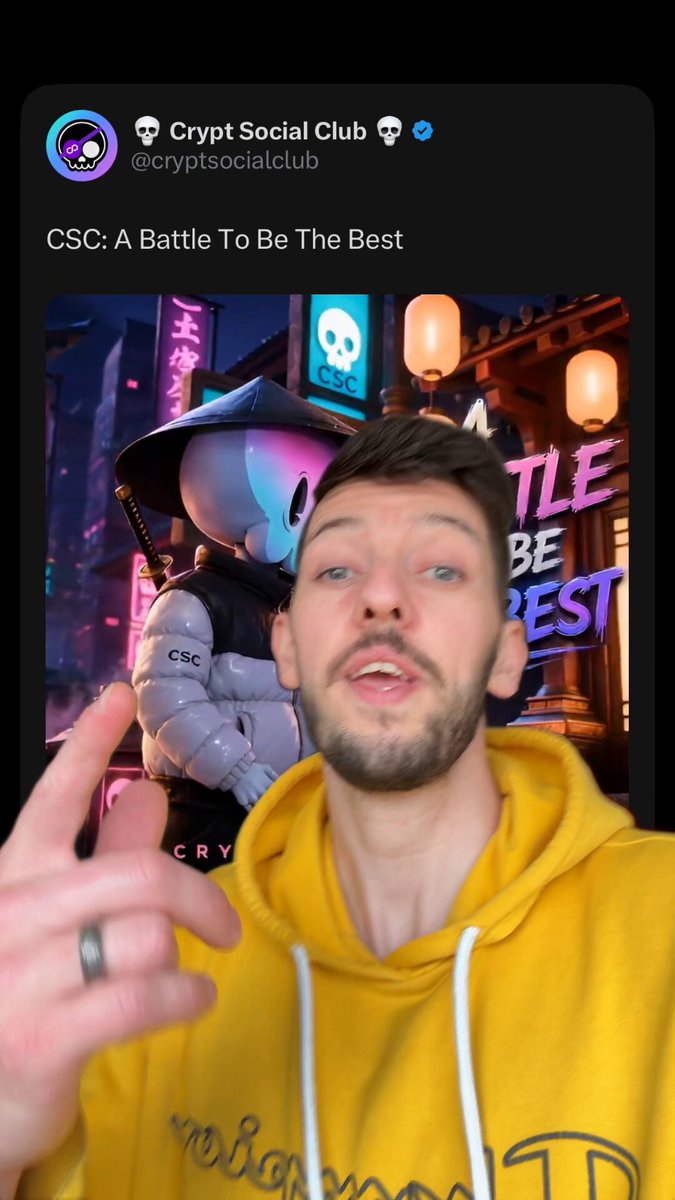 The image features a man wearing a yellow hoodie, with his hand extended towards the camera. He appears to be making a gesture or giving a thumbs up sign. The background of the image shows an illustration of a city street at night, which is part of a social media post about a Crypt Social Club event. 

The caption on the image reads "@cryptsocialclub Awesome community". This indicates that the man's hand gesture and the overall content of the image are related to or promoting the Crypt Social Club event.