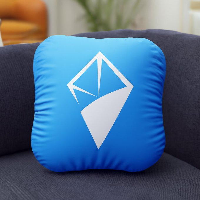 A bright blue square pillow displaying a white and blue logo that resembles a stylized diamond or kite shape, resting on a dark gray couch.