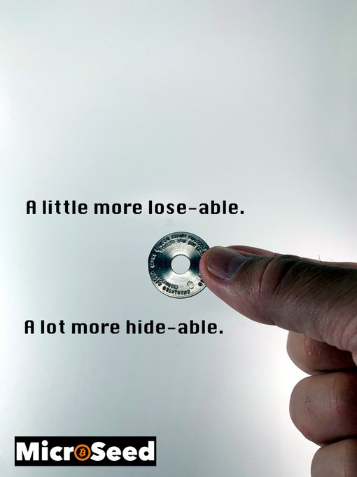 An advertisement for MicrSeed shows a hand holding a small coin-sized disc between fingers with text reading 'A little more lose-able. A lot more hide-able.'