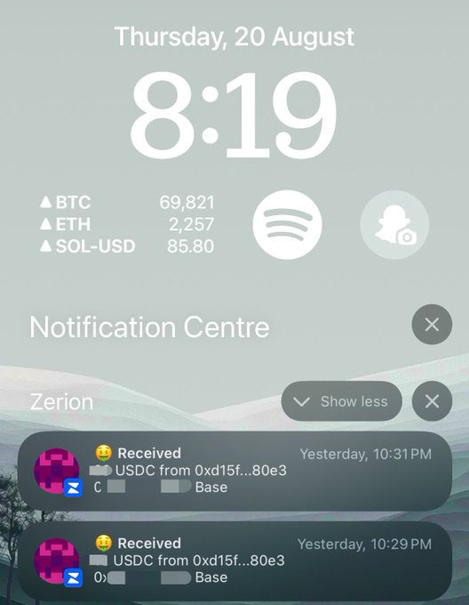 iOS lock screen showing Thursday, 20 August at 8:19, displaying cryptocurrency prices (BTC 69,821, ETH 2,257, SOL-USD 85.80) and USDC deposit notifications in Notification Centre.