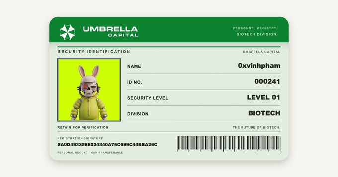 This image displays an Umbrella Corporation security ID card, featuring the iconic green header with the umbrella logo and "UMBRELLA CAPITAL" branding. The card belongs to user "0xvinhham" with ID number 000241, assigned Security Level 01 in the Biotech Division. On the left side is an avatar of a figure wearing a yellow hazmat suit and white rabbit mask with a red targeting reticle, set against a bright green background. The card includes a registration signature hash "SA0D49335EE024340A75C699C44BBA26C" and a barcode at the bottom, along with the text "RETAIN FOR VERIFICATION," "PERSONAL RECORD / NON-TRANSFERABLE," and the tagline "THE FUTURE OF BIOTECH."

The image directly ties to the accompanying post promoting "@umbrellacap_" and an Umbrella Corporation membership site at "wl.umbrellas.capital," serving as a visual example of the personalized security ID