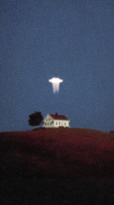 An atmospheric nighttime image showing a lit house on a dark hill beneath a glowing cross-shaped cloud or light in the dark blue sky.