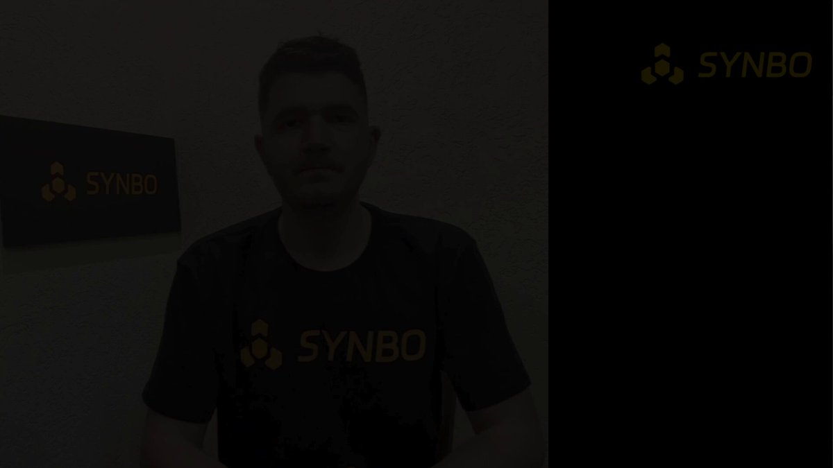 The image features a man wearing a black t-shirt with SYNBO written across it, standing against a white background. The text "BlackRock just launched a Bitcoin Income ETF (BITA)" is displayed above him, indicating that he is associated with the launch of this new fund. The image also includes a caption about Bitcoin ETFs and their performance in recent weeks, which suggests that the man might be knowledgeable or involved in the cryptocurrency market.