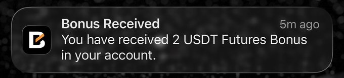 A push notification reading "Bonus Received: You have received 2 USDT Futures Bonus in your account," sent 5 minutes ago.