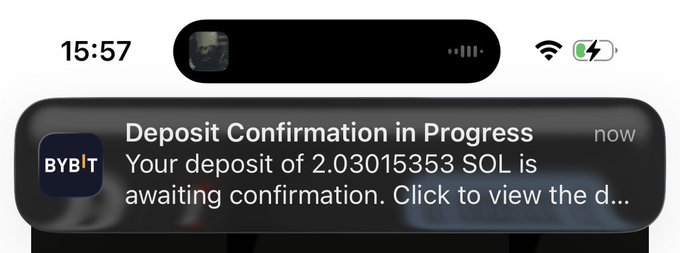 A mobile phone notification screenshot from Bybit stating 'Deposit Confirmation in Progress: Your deposit of 2.03015353 SOL is awaiting confirmation.'