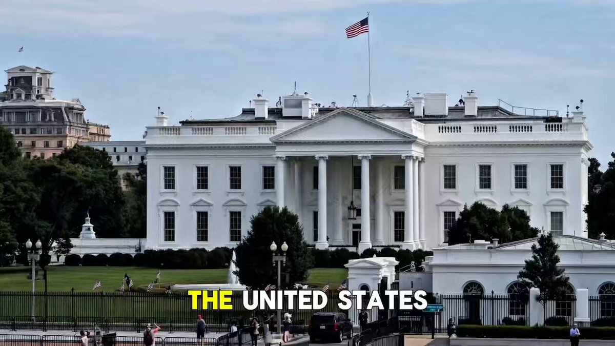 The image features a large white building with an American flag flying atop of it, which appears to be the White House. The text "THE UNITED STATES" can also be seen in the image. In addition to the main focus on the White House, there are several people walking around and enjoying their time at the location.
