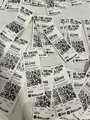 A pile of scratch-off lottery tickets, with one winner's ticket revealing $2,049—a playful prize announced for the TOKEN2049 week in Singapore.