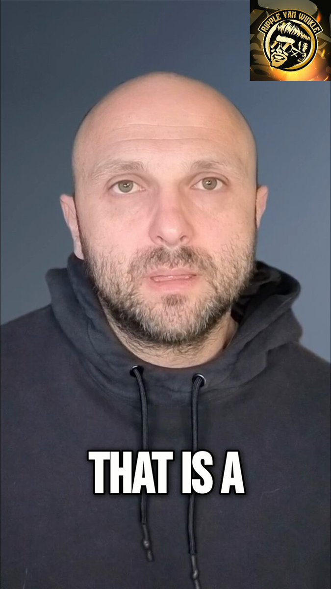 The image features a bald man wearing a black hoodie, with his face partially visible behind him. The caption reads "That's A", which seems to be a joke or a pun related to the statement about XRP being legal or not.