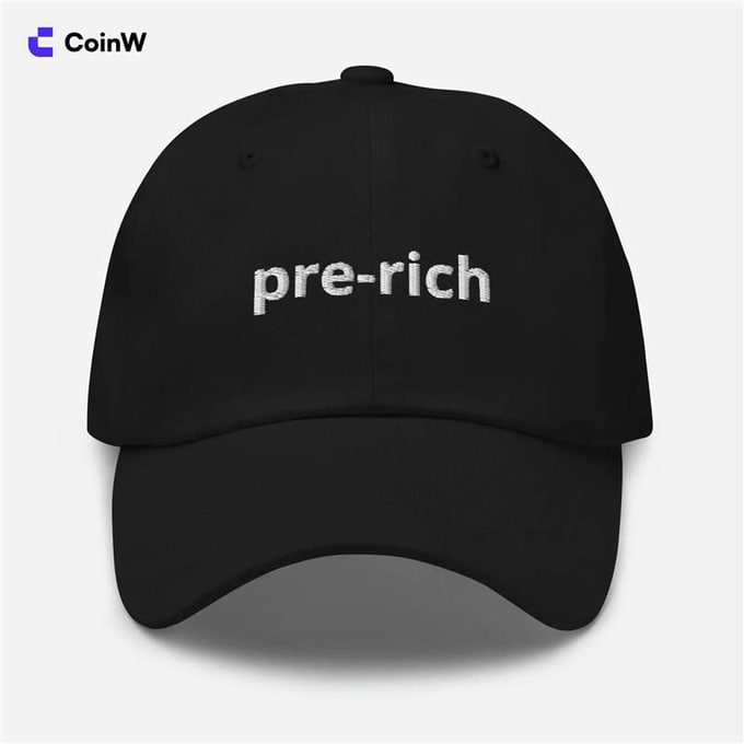 A black baseball cap with white embroidered text reading 'pre-rich', branded with the CoinW logo in the upper left corner.