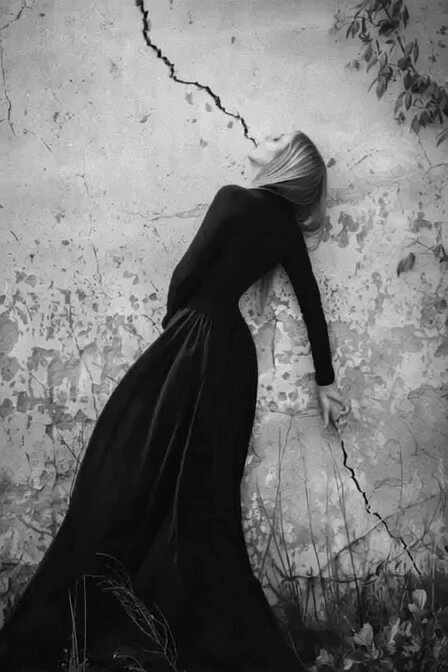 The image features a woman wearing a long black dress with her head resting on a wall. The photo has been edited to appear as if she is lying down or sleeping, giving an impression of a sense of tranquility and relaxation. The caption below the image reads "Late GM! Hope you are enjoying this Tuesday Have a great #TEZOSTUESDAY! Let' s keep moving! We can make it happen, against all odds!".