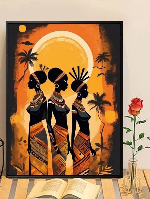 A framed African-inspired artwork depicting three silhouetted women with traditional jewelry against a vibrant orange sunset background, displayed next to a vase with a red rose.