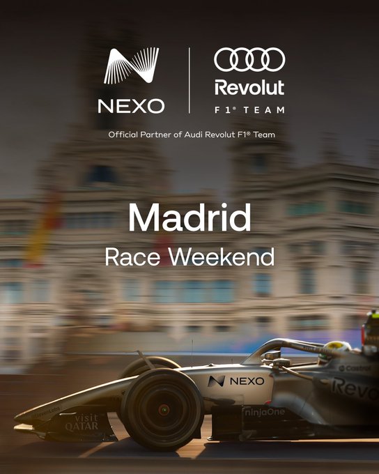 The image shows a motion-blurred Formula 1 race car featuring "NEXO" branding speeding past a Madrid cityscape, promoting the Madrid Race Weekend as "Official Partner of Audi Revolut F1 Team" with Audi and Nexo logos at the top.