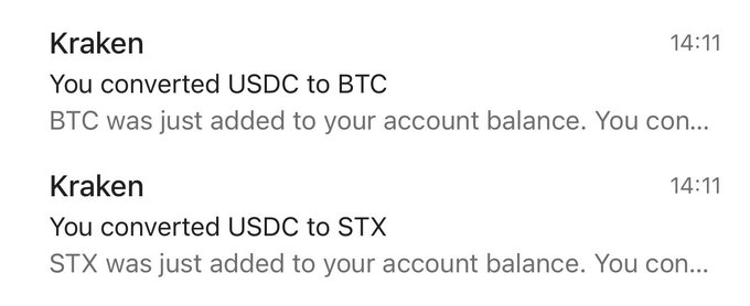 The image shows two Kraken notifications timestamped 14:11, confirming the conversion of USDC to BTC and USDC to STX, with both BTC and STX added to the user's account balance. These notifications illustrate the user restarting their daily dollar-cost averaging (DCA) purchases of $BTC and $STX on Kraken, supporting their bullish stance on Stacks ahead of the Satoshi upgrades and Bitcoin staking features.