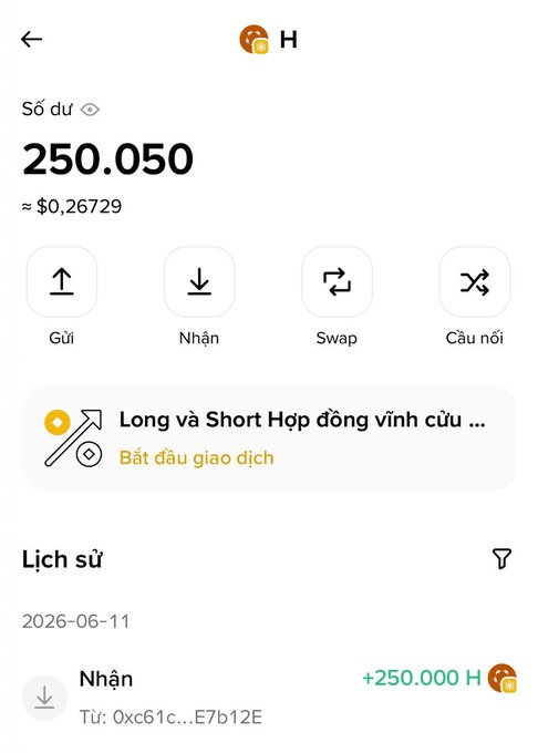 The image shows a phone screen displaying a message from someone named "Lich". The message contains text written in Vietnamese, which translates to "Long va Short Hop dùng tham gia chương trình khôi phục do loss của dự án và đền bù tổn thất bằng số lượng token $H như hình." The message also includes a link to an account, which is described as "long và khôi phục do loss của dự án và đền bù tổn thất bằng số lượng token $H như hình."