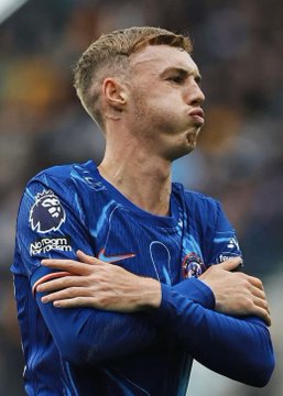 A Chelsea player in a blue Premier League jersey crosses his arms in celebration. The image relates to a $700k bet placed on Chelsea winning their opening Premier League match against Fulham on Polymarket.