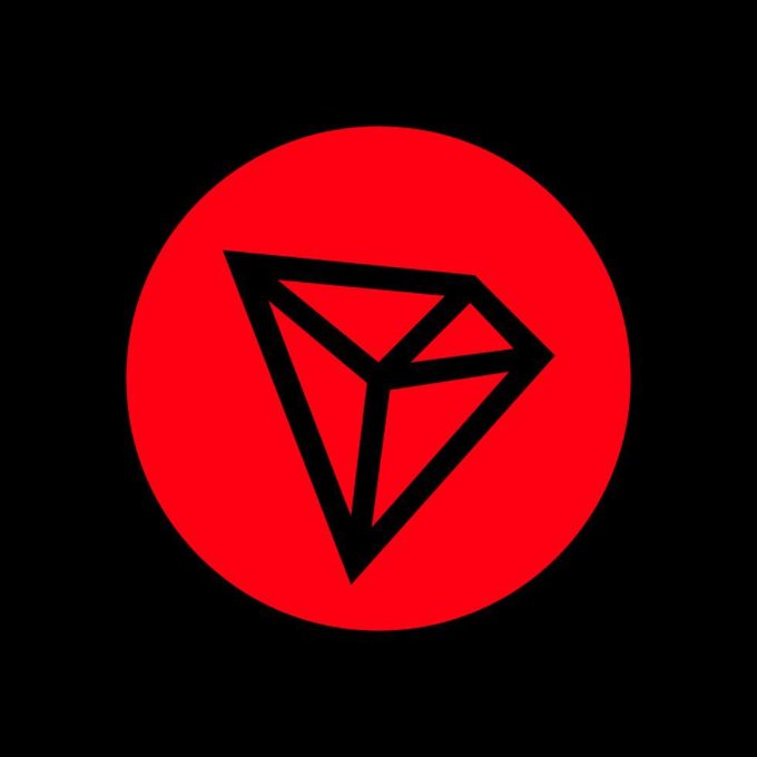 Logo featuring a black geometric gem/diamond shape inside a red circle on a black background.