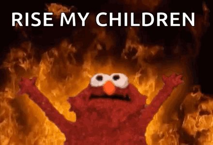 The image features a red Elmo character with his arms raised high above his head, surrounded by flames. The background of the image is black, which contrasts with the vibrant red color of the Elmo character. The text "Rise My Children" is written in white at the top of the image, and the phrase "@Aster_DEX" appears below it. This combination of elements creates a visually striking scene that captures attention and conveys a strong message about the importance of family and unity.