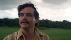The image features a man with a mustache wearing a striped shirt, standing in an open field under cloudy skies. The surrounding area consists of trees and grass, creating a natural backdrop for the scene. The caption below the image reads "When everyone else worried about their assets but I have my @Ledger". This phrase is likely a reference to the man's unique identifier or personal brand that he has established through his work in the film industry.