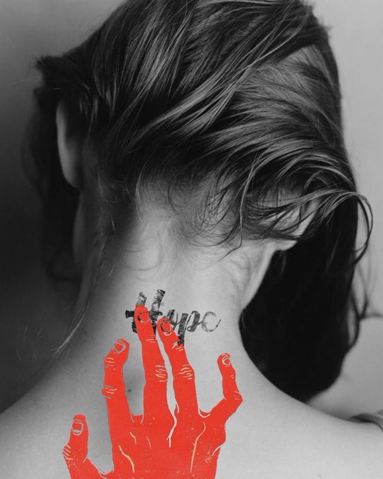 A black-and-white photograph of a woman from behind, with a tattoo on her neck spelling 'hope' (partially crossed out) and a red-painted hand reaching up over it.