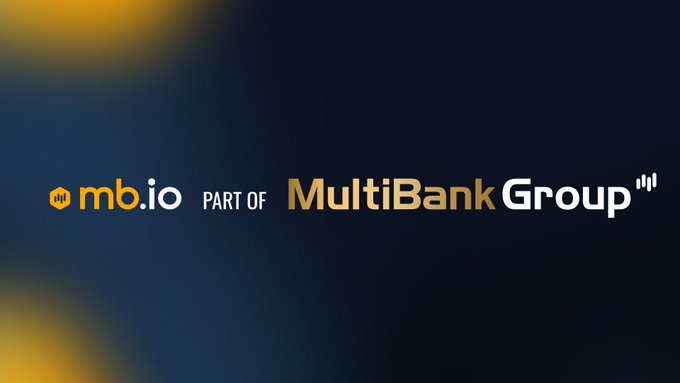 The image displays the "mb.io" logo alongside the text "PART OF MultiBank Group," set against a dark blue background with yellow accents. The branding relates to the post by visually tying the message about crypto's evolving user base and settlement speed to MultiBank Group's identity as a financial services provider positioning itself within this next wave of crypto adoption.