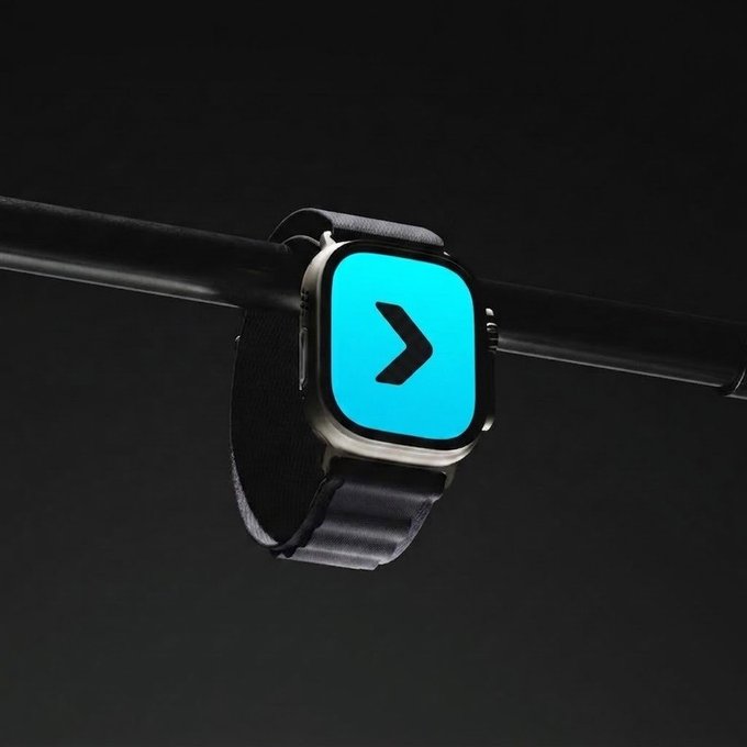 A smartwatch with a black band displayed against a dark background, showing a bright cyan screen with a black right-facing arrow icon.